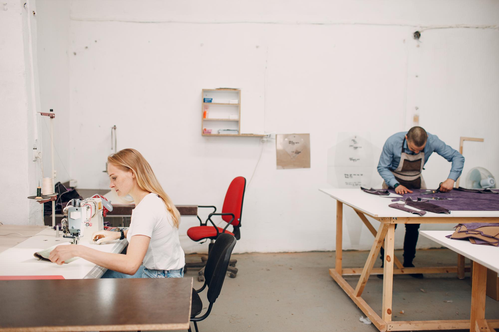 studio interior with students stitching